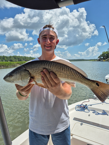 Huge 28-inch redfish reeled in during stormy weather!