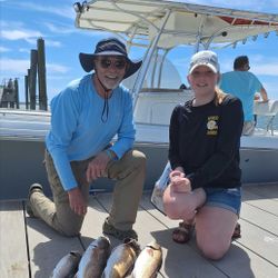 Two redfish, each around 6 inches long, caught while fishing on Hilton Head Island