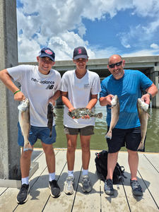 Triple Redfish action on a stormy day at the landing!