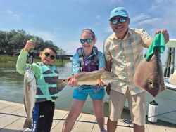 Three redfish caught on a fishing trip at Hilton Head Island