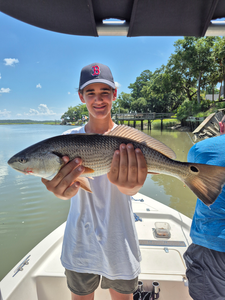Reeling in a huge redfish on a stormy day in Hilton Head!