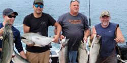 Anglers with 5 rainbow trout and chinook salmon in New York