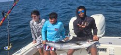 Fisherman holding a large Atlantic Sailfish in FL