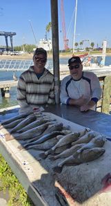 Two people fishing for redfish in Fort Pierce