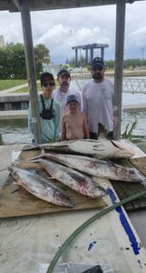 Group of 4 people fishing in Fort Pierce