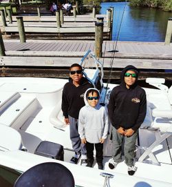Three people fishing at Fort Pierce