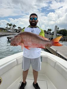 Large mutton snapper catch displayed on fishing boat in Fort Pierce FL