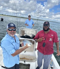 Three people fishing at Fort Pierce