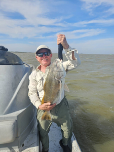 Angler with 15-inch fish in TX