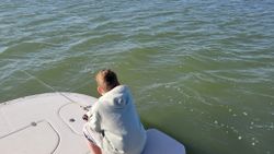 A lone fisherman casting his line in TX