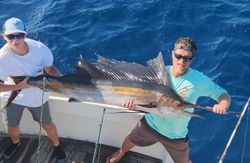 Two people fishing for an Atlantic Sailfish in Norfolk