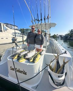 A pair of anglers fishing in Tavernier with a 13-inch catch