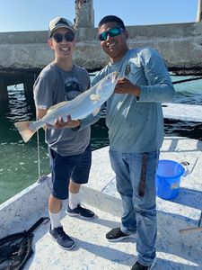 Two people fishing in TX
