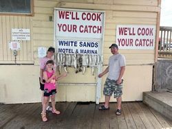 Three people fishing in TX