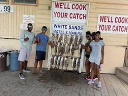 Three people fishing at South Padre Island