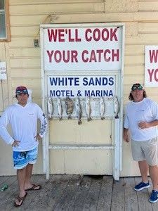 Two people fishing at South Padre Island