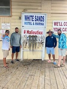 4 people enjoying fishing at South Padre Island