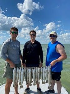 A group of 3 people fishing in TX