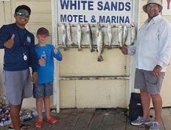 3 people fishing with rod at South Padre Island