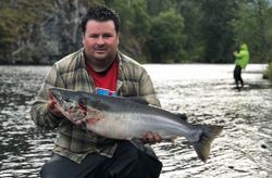 Fisherman catching a fish in Larsen Bay