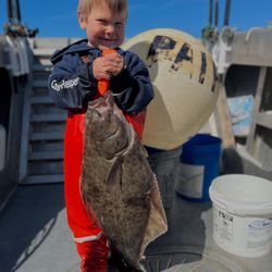 A Pacific Halibut being caught while fishing in Larsen Bay