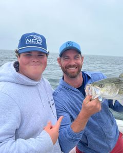Two anglers enjoying a fishing tour in East Dennis