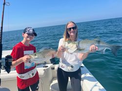Two striped bass caught during a fishing trip in MA