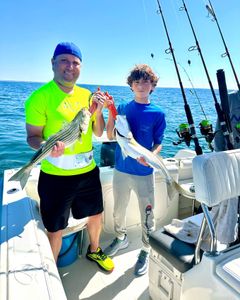 Two striped bass caught on a fishing tour in MA