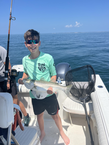 Clearing skies and a 20-inch Striper - perfect fishing day!