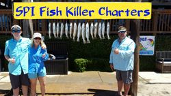 4 people enjoying fishing at South Padre Island