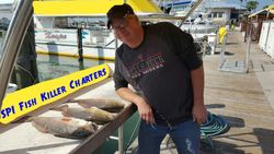 Three fishing rods on South Padre Island beach
