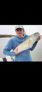 Fisherman holding a 17-inch fish in TX