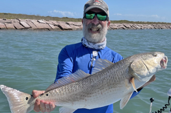 Photograph of a 31-inch redfish caught while fishing in Aransas Pass