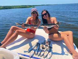 Two anglers fishing in Brunswick with 2 big fish