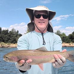 Angler fishing for a rainbow trout in Anderson