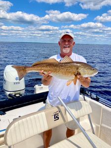 Angler with a huge redfish caught in FL
