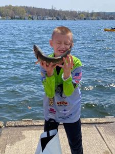 Angler with a 9-inch fish caught in NY