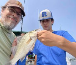 Two anglers with a small fish in New York