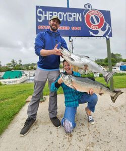 Two Chinook salmon being caught while fishing in WI