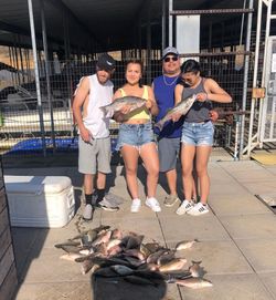 Three fishing enthusiasts enjoying the great outdoors in Kingston