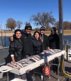 Five people enjoying a fishing and hunting adventure in Kingston