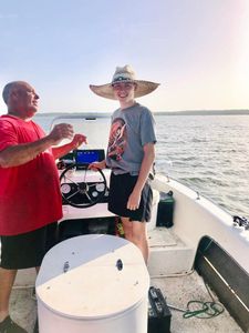 Two people enjoying a fishing and hunting adventure in OK
