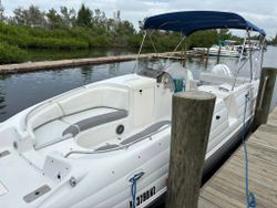 White boat docked at marina in Placida FL ready for tours