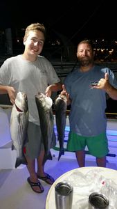 Striped bass, Atlantic bonito, and striped bass caught while fishing in MA