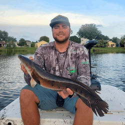 A angler holding a big fish in Delray Beach