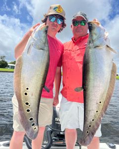 Two anglers fishing on the shore in FL