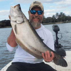 A person fishing in Delray Beach