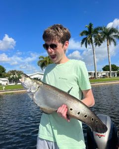One fisherman catching a 25-inch fish in Delray Beach