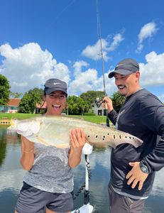 A couple fishing with a 30-inch catch in FL