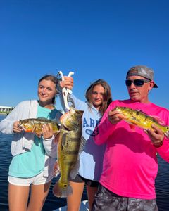 3 happy anglers with their big catch in Florida